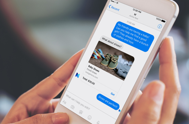 Hands hold a smartphone. The smartphone displays messages related to a question about finding a gift for a baby and an answer of shoes.