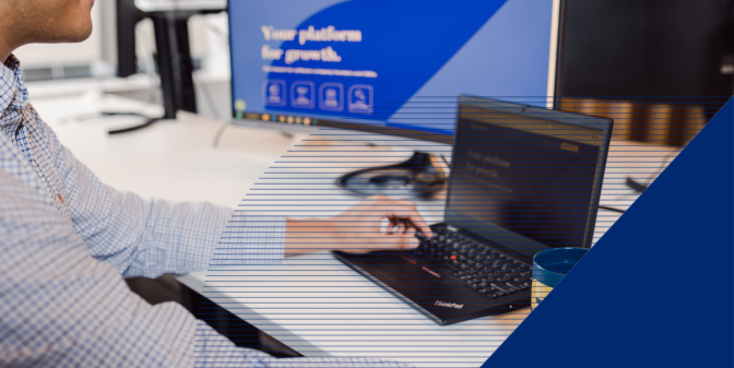A person working on his laptop with abstract graphics on the photo